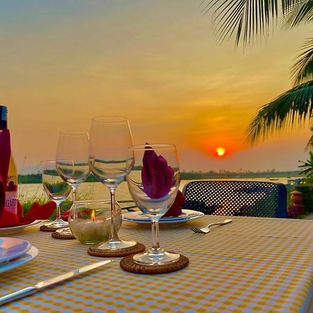 Bel Marina Hoi An Resort Екстер'єр фото Sunset at the Riverine Restaurant