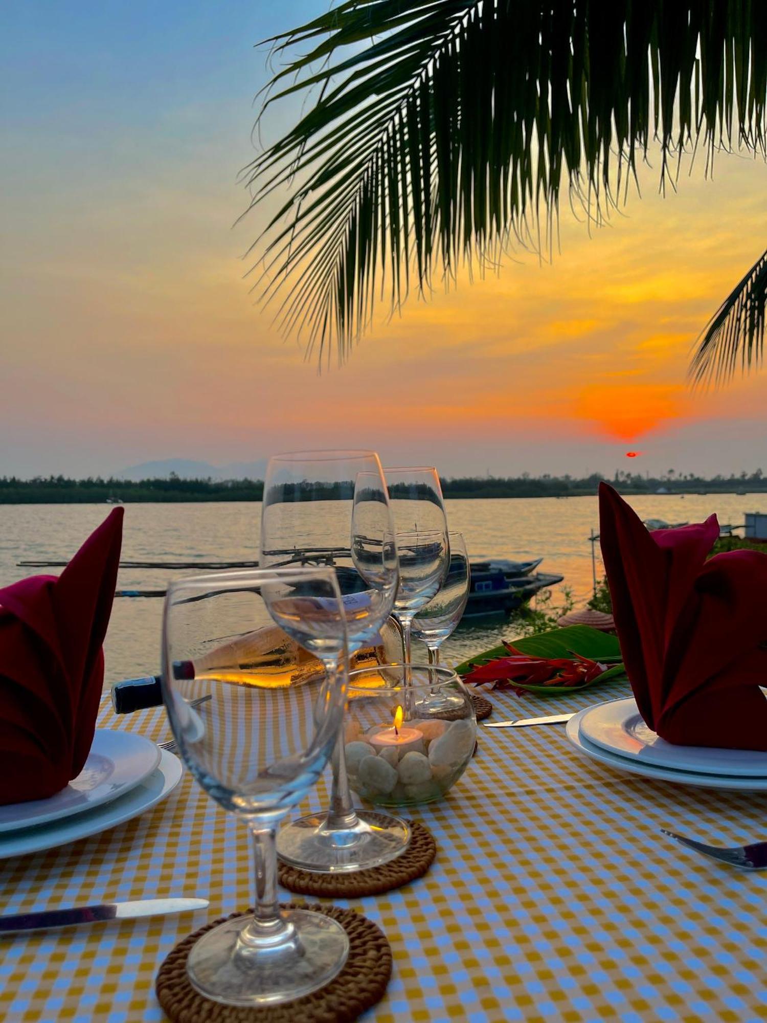 Bel Marina Hoi An Resort Екстер'єр фото Sunset at the Riverine Restaurant